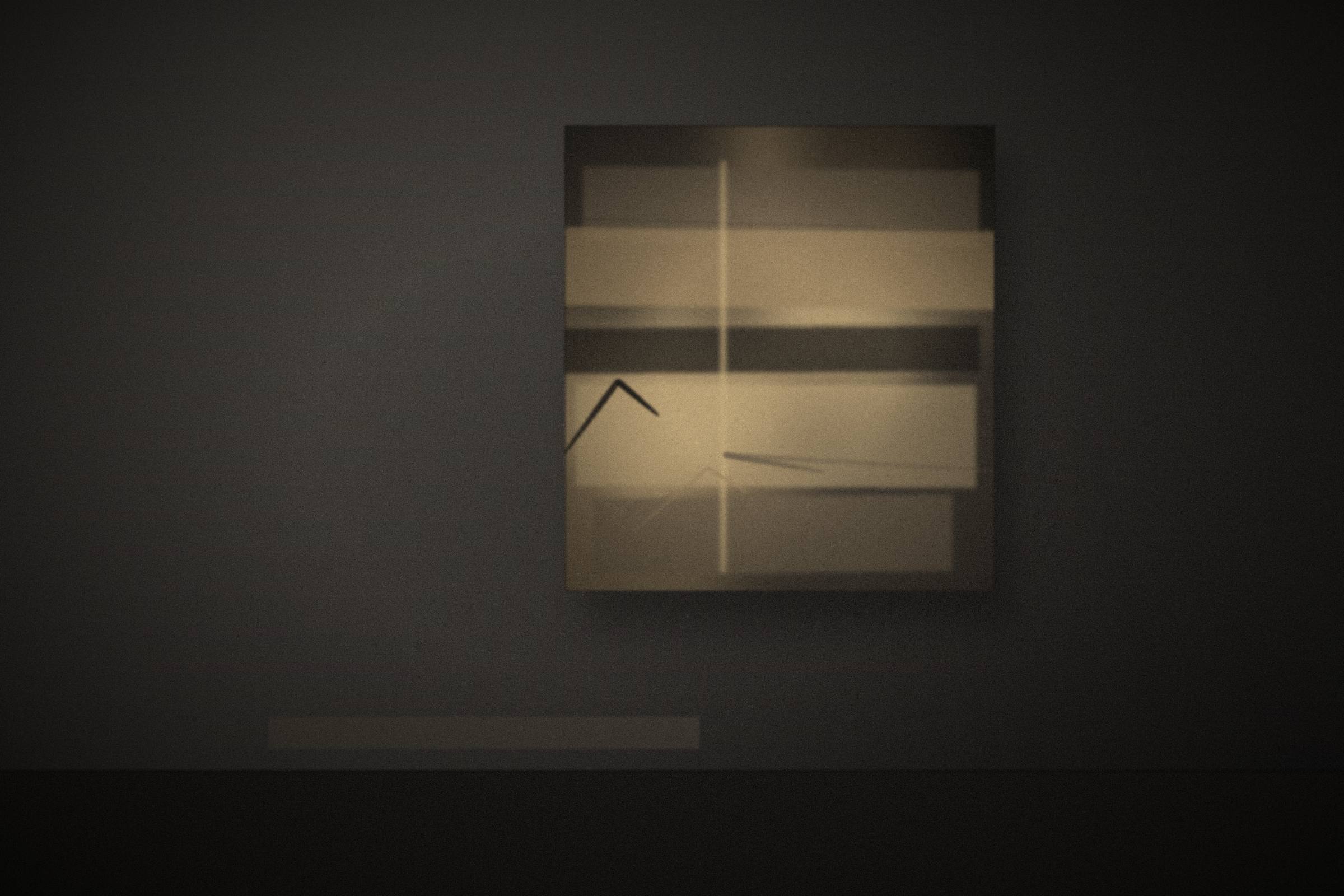 An original painting hanging in a quiet, light-filled room